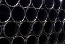 Steel Profile Materials Used In Industry. Stacked Iron Pipes. Selective Focus Middle Pipe