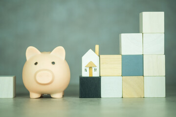 Poster - Pink piggy bank, wood home and wooden block