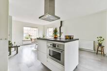 White Kitchen Interior With Built In Oven In Daylight