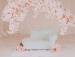 a set up for a toddler baby photo session in a photo studio with a cherry tree and blue couch