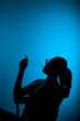 © qunica.com - Silhouette on a blue backround