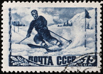 Wall Mural - Vintage skier on old russian postage stamp