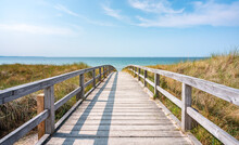 Wooden Walkway At The Beach In Summer
