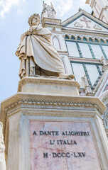 Wall Mural - Dante Alighieri statue in Florence, Tuscany region, Italy, with amazing blue sky background.