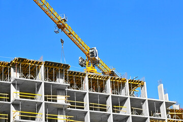 Crane and highrise construction site