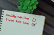 Concept of Fixed Rate Loan write on a sticky notes isolated on Wooden Table.