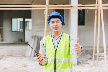 Wall Mural - worker foreman home builder hand sign thumbs up for good pass build and safety quality confirm concept.