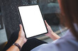 © Farknot Architect - Mockup image of a woman holding digital tablet with blank white desktop screen