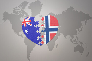 puzzle heart with the national flag of norway and australia on a world map background. Concept.