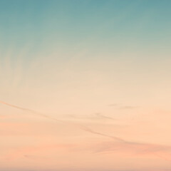 Wall Mural - sunset background. sky with soft and blur pastel colored clouds. gradient cloud on the beach resort. nature. sunrise.  peaceful morning. Instagram toned style