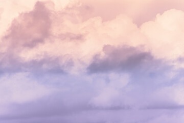 Wall Mural - twilight sky with effect of light pastel orange colors. colorful sunset of soft clouds.