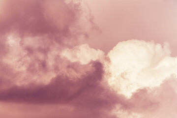 Wall Mural - twilight sky with effect of light pastel orange colors. colorful sunset of soft clouds.