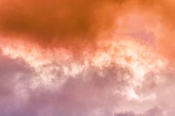 Wall Mural - twilight sky with effect of light pastel orange colors. colorful sunset of soft clouds.