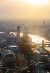 Wall Mural - City of London at sunset. View include modern skyscrapers, banks and office buildings, river Thames, London bridge.