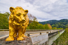 Bridge Marked With Giant Gold Bear Statue At Entrance
