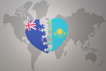 puzzle heart with the national flag of new zealand and kazakhstan on a world map background. Concept.