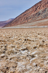 California Death Valley salt flats in detail by mountains