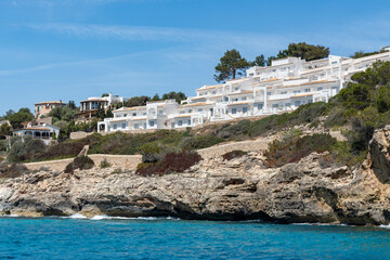 Wall Mural - typical houses with orange tiled roofs on the coast of mallorca, porto christo 