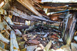 Inside destroyed shipwreck with parts falling on ground