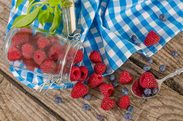 Wall Mural - Jar of raspberries on the table