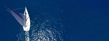 Aerial Drone Ultra Wide Panoramic Photo Of Beautiful Sail Boat Cruising Deep Blue Aegean Sea