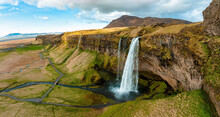Aerial View Of The Seljalandsfoss - Located In The South Region In Iceland Right By Route 1. Visitors Can Walk Behind It Into A Small Cave. Most Popular Waterfall In Iceland.