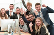 © ASDF - portrait of a happy business team at an office Desk