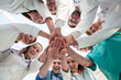 © ASDF - bottom view. diverse medical professionals showing their unity.