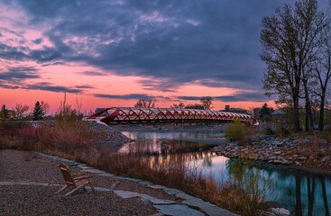 Wall Mural - Cloudy Sunrise Over A Park By The Peace Bridge