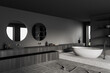 Grey bathroom interior with sink and bathtub, towel and accessories