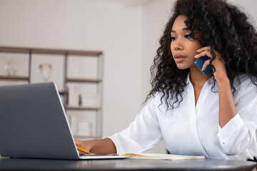 Sticker - Young attractive businesswoman wearing formal wear is talking on smartphone