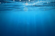 © kichigin19 - ocean underwater rays of light background, under blue water sunlight