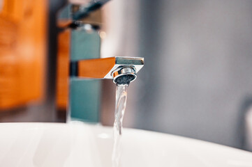 Wall Mural - Water tap , faucet. Flow water in bathroom with sink. Modern clean hause. Hygiene concept. Panorama