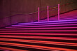 Night view of staircase light up in red, purple, pink