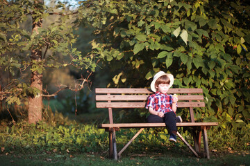 Leaf fall in the park. Children for a walk in the autumn park. Family. Fall. Happiness.