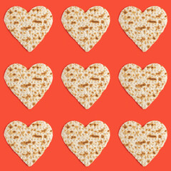 Wall Mural - Seamless pattern with matzah in the form of heart for Jewish holiday Pesach on red background.