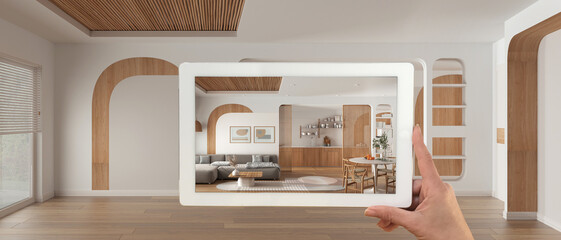 Wall Mural - augmented reality concept. hand holding tablet with ar application used to simulate furniture and de