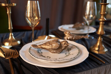 at the served table, glasses and dishes on the table 