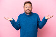 © luismolinero - Middle age caucasian man isolated on pink background having doubts
