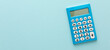 © Alina Zavhorodnii - blue calculator on a colored background