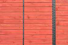 Industrial Background - View Of The Wall Of A Old Wooden Railway Wagon. Background Of Wooden Boards Close Up