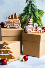 Christmas Gingerbread Cookies On Gift Boxes Next To A Christmas Tree Ornament