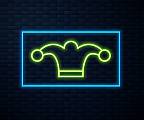 Wall Mural - Glowing neon line Jester hat with bells isolated on brick wall background. Clown icon. Amusement park funnyman sign. Vector