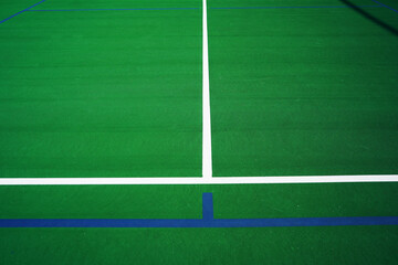 Wall Mural - A Tennis Court has been marked off with blue tape for pickleball.     