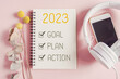 2023 New year resolution, Goal, Plan and action on notepad  with phone and headphone