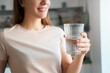 © Stock 4 You - Young female hand holds glass of clear water cropped shot