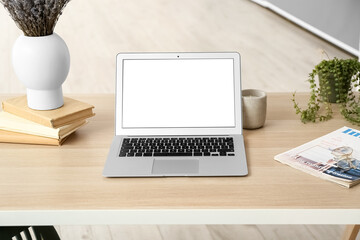 Sticker - Modern laptop, books and magazine on table