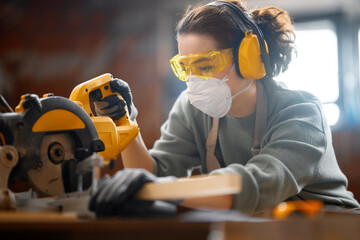 Wall Mural - woman carpenter in workshop