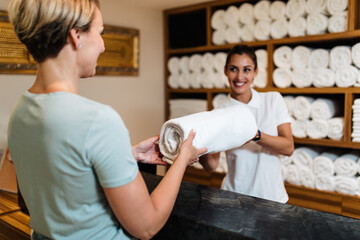 Beautiful young woman working at hotel in spa department.