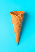 Empty Ice Cream Cone Waffle Close-up On A Light Blue Background. Top View, Vertical.